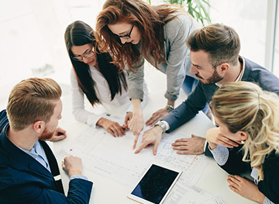 Group of business professionals collaborating around a table