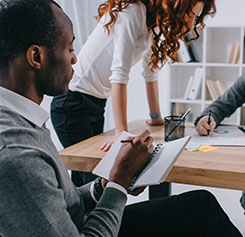 diverse business professionals around a table